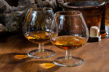 Tasting of aged french cognac brandy alcoholic drink in old cellars of cognac-producing regions...
