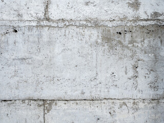 Abstract corrugated concrete wall texture background. Grey crack and broken cement tiles block wallpaper. Old grunge surface stone building construction.