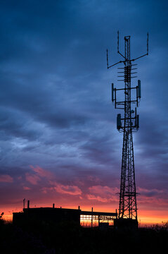 A view of a cell tower at dusk