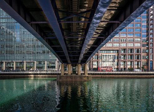 A view of a body of water from underneath a bridge
