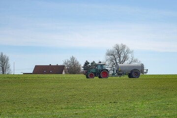 Agricultural machine for watering and fertilizing the land with liquid manure in a farm.