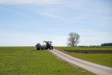 Agricultural machine for watering and fertilizing the land with liquid manure in a farm.