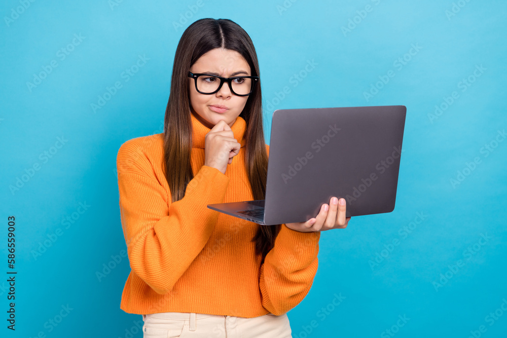 Sticker Photo of thoughtful intelligent girl long hairstyle wear knit turtleneck look at laptop doing homework isolated on blue color background