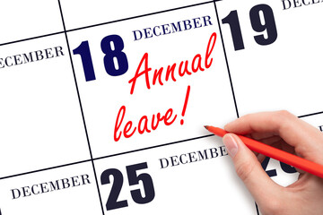 Hand writing the text ANNUAL LEAVE and drawing the sun on the calendar date December 18