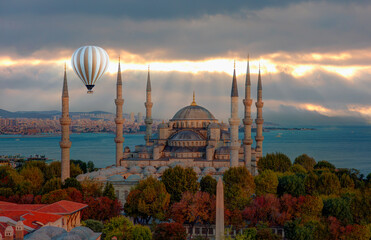 Hot air balloon flying over The Blue Mosque (Sultanahmet) - Istanbul, Turkey 
