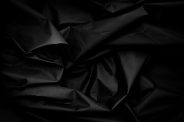 Black nylon texture. minimalist and elegant crumple textile. simple dark background