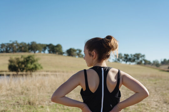 behind view of teen girl going for a morning jog