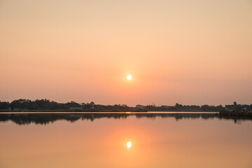 Naklejka na ściany i meble Sunset at the lake landscape