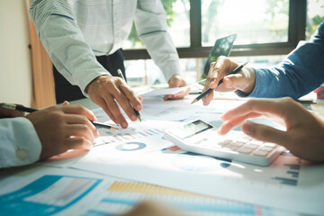 Businessmen working together at desk.