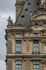 Fototapeta na wymiar Paris, France - 26.09.2021 : Detail of the facade of the Louvre museum in Paris.