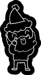 man with beard sticking out tongue wearing santa hat