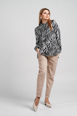 beautiful female posing in a business outfit. Employee and business concept.