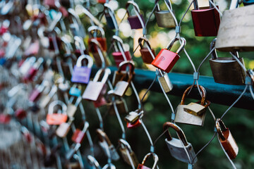 Love locks hanging on fence