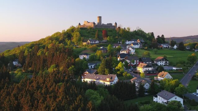 Old castle on a hill in Germany. Drone flight forward