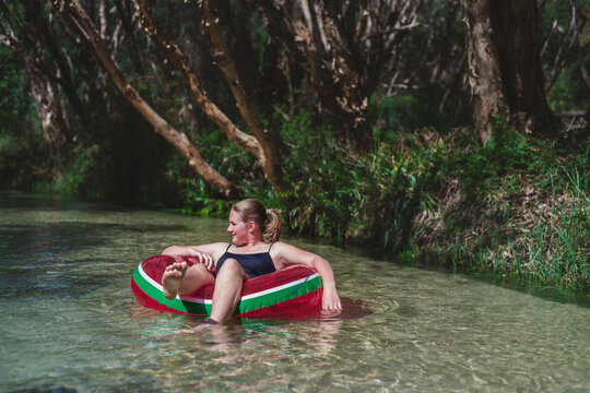 teens floating down Eli Creek, Fraser Island