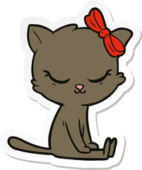 sticker of a cute cartoon cat with bow