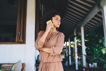 Millennial female connecting to 4g in roaming for calling and talking with operator about international communication, Caucaisan woman phoning via cellular application for discussing mobility