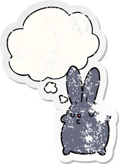 cute cartoon rabbit and thought bubble as a distressed worn sticker
