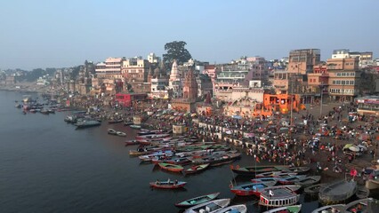 Aerial view of the Varanasi ghats on the banks of the sacred Ganges river at sunrise in Varanasi, Uttar Pradesh, India.