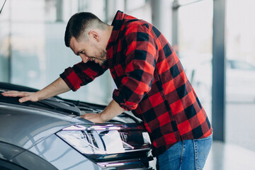 Young man making diagnostics of the vehicle