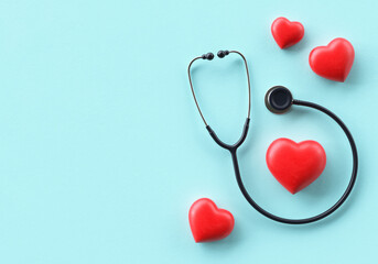 Fototapeta premium World Health Day banner background template with doctor stethoscope and hearts in flat lay and copy space, realistic 3D rendering. Global health awareness day celebrated every year on 7th April