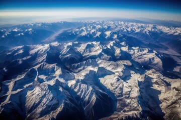 Obraz premium Aerial View of Breathtaking Snow-Capped Mountain Range