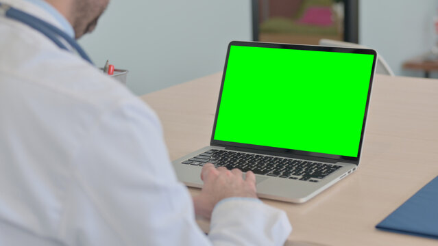 Close Up of Doctor Using Laptop with Green Screen - Powered by Adobe