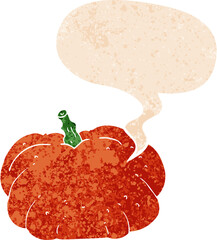 cartoon pumpkin and speech bubble in retro textured style