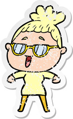 distressed sticker of a cartoon happy woman wearing spectacles