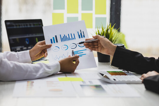 Businesswoman financial consultant discuss investment analysis of business project and plan market share strategy. Meeting to discuss the analysis of risks and investment returns.