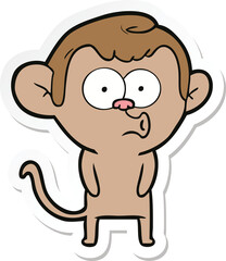 sticker of a cartoon hooting monkey