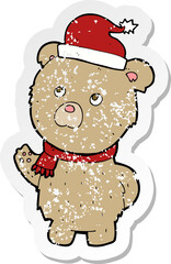 retro distressed sticker of a cartoon christmas teddy bear