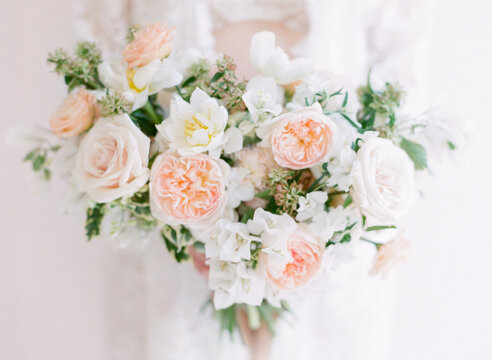 A Woman Holding A Lush Bouquet of wedding Flowers