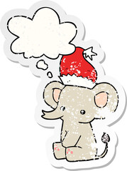 cute christmas elephant and thought bubble as a distressed worn sticker