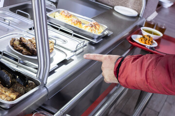 a tray of food on the table before eating in a food service close-up, the front and back backgrounds are blurred with a bokeh effect