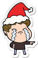 sticker cartoon of a man crying wearing santa hat