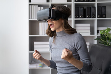 Fototapeta na wymiar Beautiful woman in virtual reality glasses having fun at home.