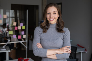 Portrait of beautiful businesswoman standing in the meeting room with confident.