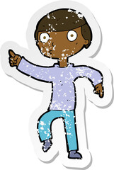 retro distressed sticker of a cartoon boy pointing