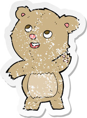 retro distressed sticker of a cartoon cute waving teddy bear