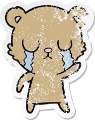 distressed sticker of a crying cartoon bear