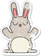 distressed sticker of a quirky hand drawn cartoon rabbit