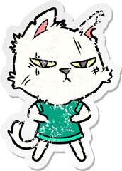 distressed sticker of a tough cartoon cat