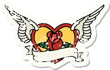 traditional distressed sticker tattoo of a flying heart with flowers and banner