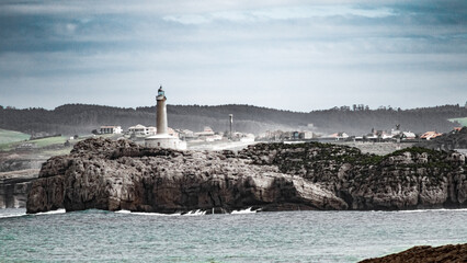 Lighthouse on the coast of Atlantic ocean.