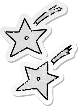 distressed sticker cartoon doodle of ninja throwing stars