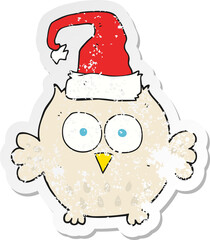 retro distressed sticker of a cartoon owl wearing christmas hat