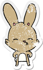 distressed sticker of a curious bunny cartoon