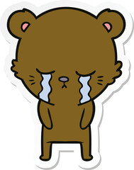 sticker of a crying cartoon bear