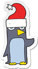 sticker of a cartoon penguin in christmas hat